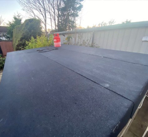 Black felt covering laid across a flat roof
